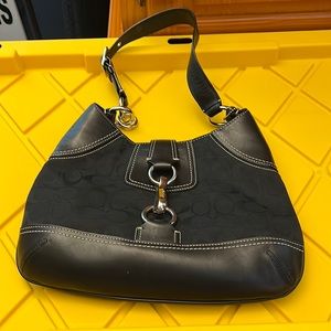 Black coach signature bag with white stitching and silver hardware